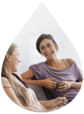 Two women having a laugh over a conversation 